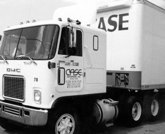 Black and white historical Case Enterprises GMC truck photo