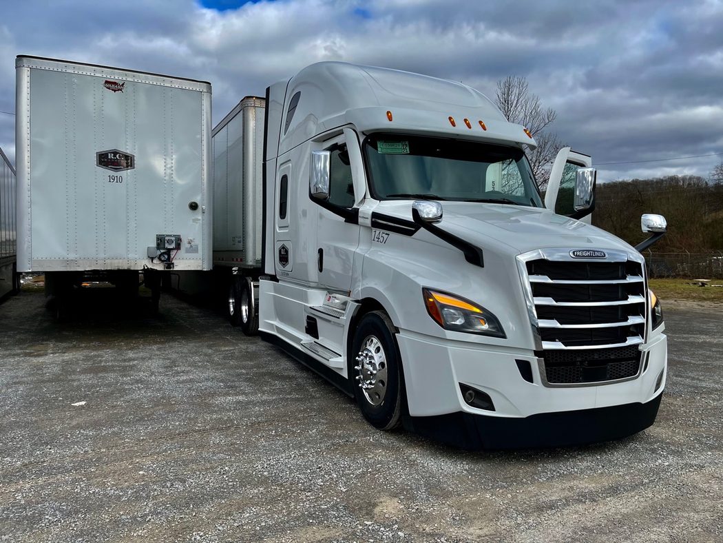 R.C. Transport white tractor with dry van trailers