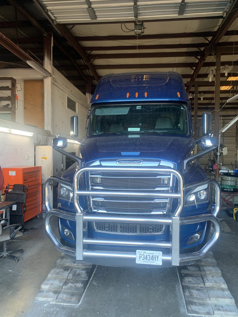 R.C. Transport blue tractor in the shop