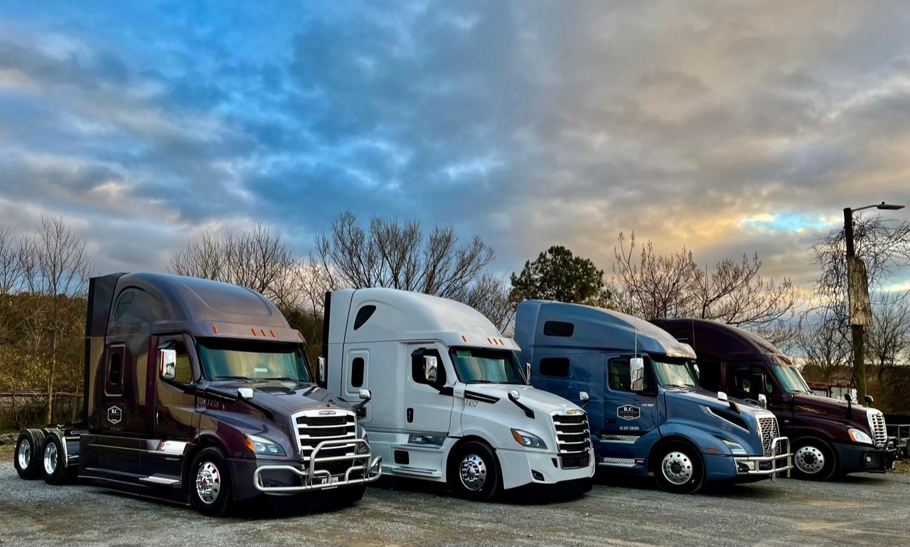Modern R.C. Transport trucks lined up at the yard