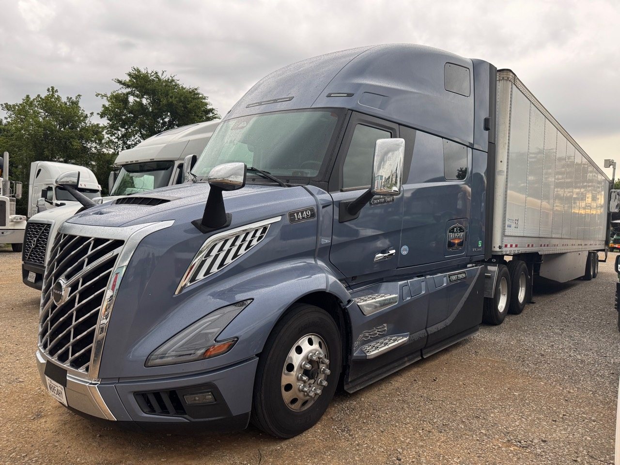 Newly branded R.C. Transport Volvo tractor with dry van trailer